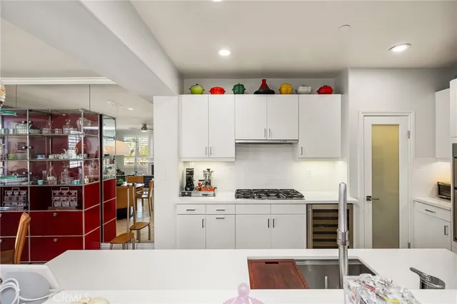 a spacious bedroom with a bed and a cabinets