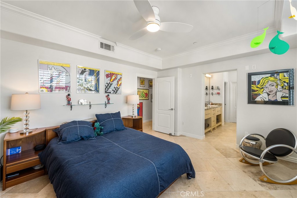 1000 East Ocean Boulevard, Unit 613 Long Beach, CA 90802 - Photo 33 of 65 a spacious bedroom with a bed and a cabinets