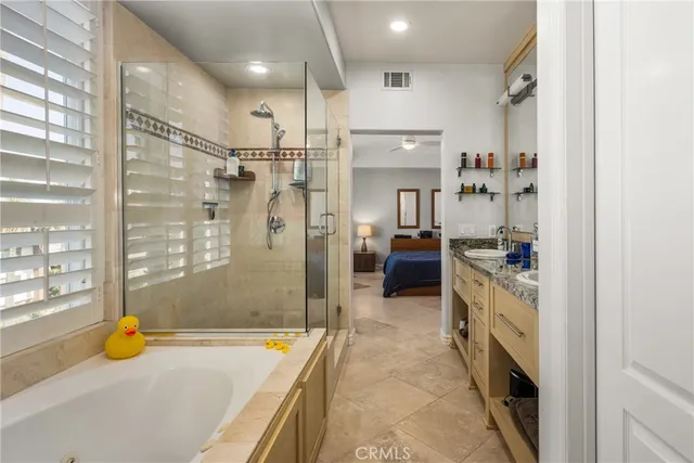 a hallway with furniture and a potted plant