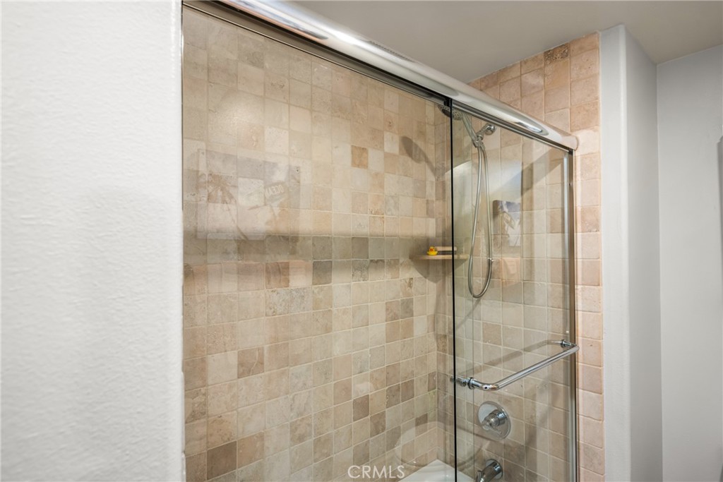 1000 East Ocean Boulevard, Unit 613 Long Beach, CA 90802 - Photo 40 of 65 a bathroom with a glass shower door