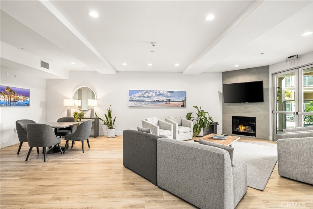 1000 East Ocean Boulevard, Unit 613 Long Beach, CA 90802 - Photo 59 of 65 a living room with furniture a fireplace and a flat screen tv