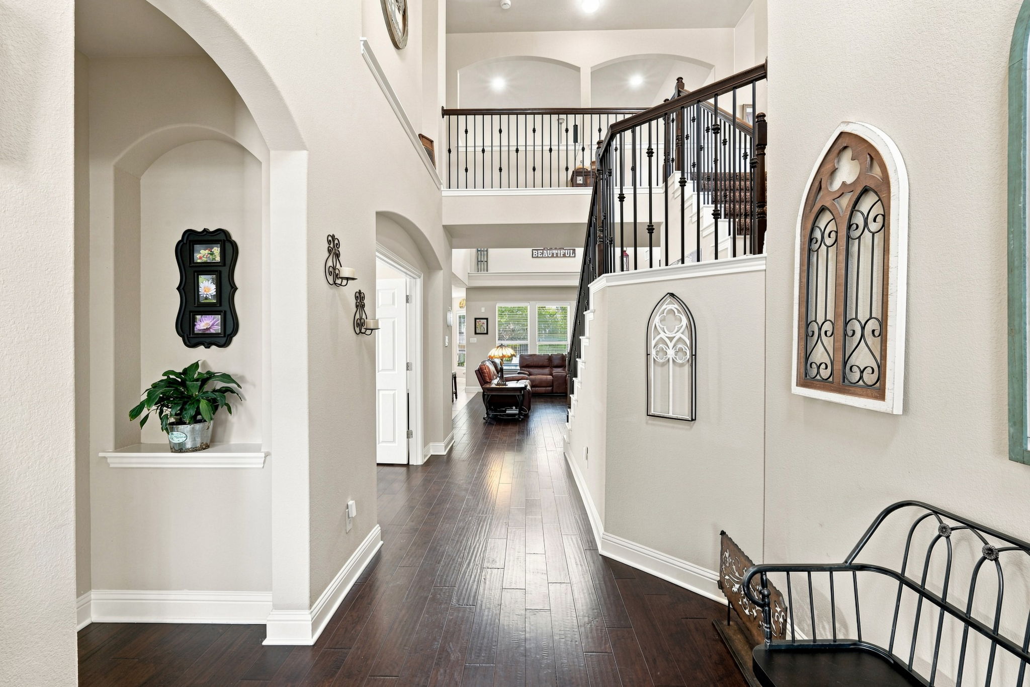 3237 Hidalgo Loop Round Rock, TX 78665 - Photo 4 of 31 Gleaming hardwood floors and a soaring two-story ceiling welcome guests into the home.