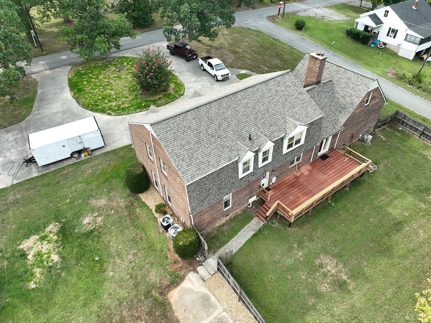 109 Juniper Cliff Road Brookneal, VA 24528 - Photo 2 of 13 an aerial view of a house with a garden and swimming pool