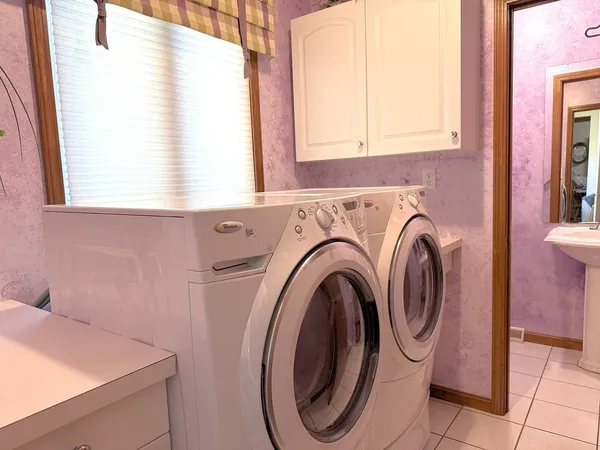 a utility room with dryer and washer