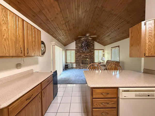 a kitchen with a sink appliances and cabinets