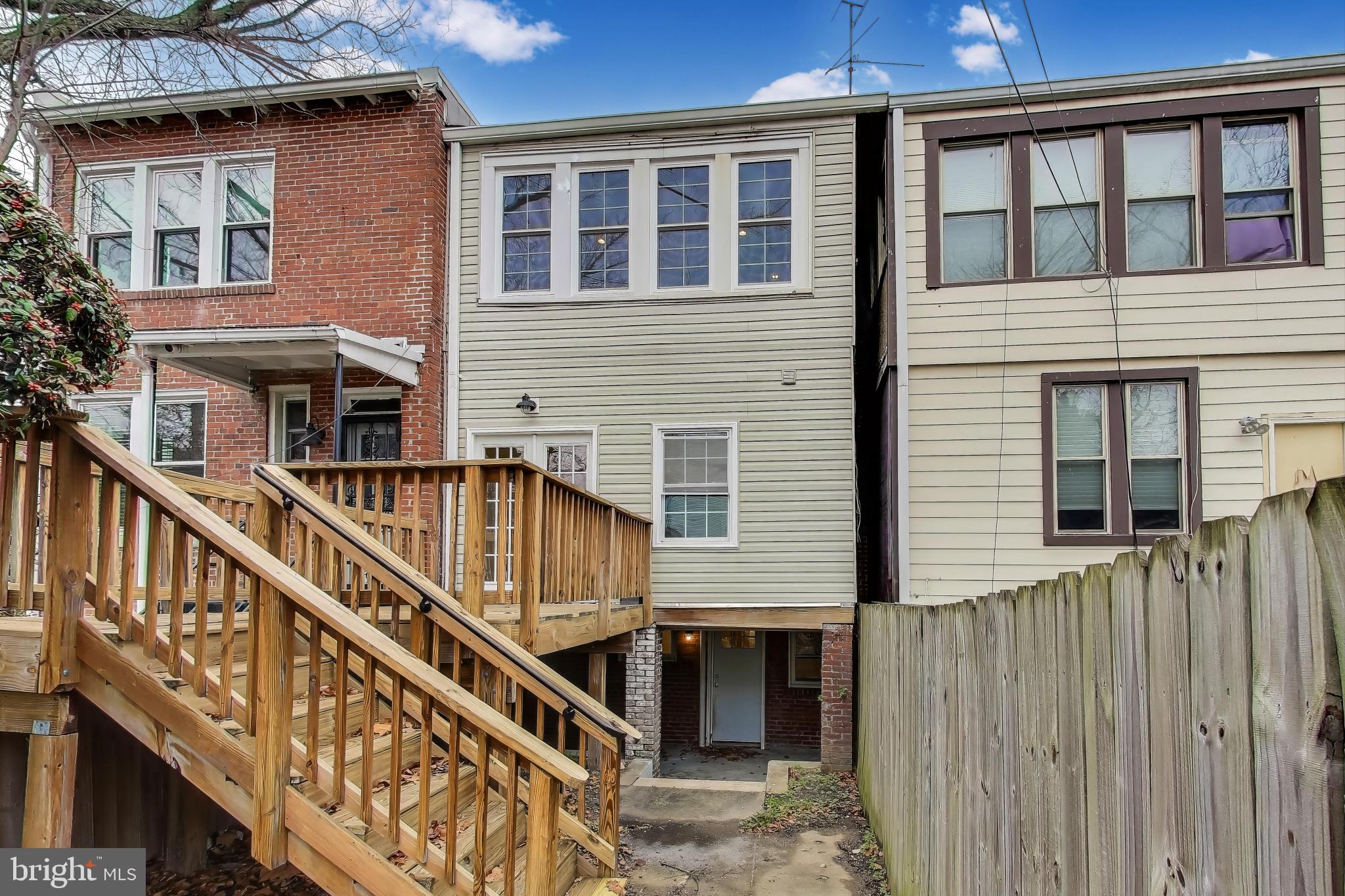 628 Madison Street Northwest Washington, DC 20011 - Photo 11 of 47 a view of a house with wooden stairs