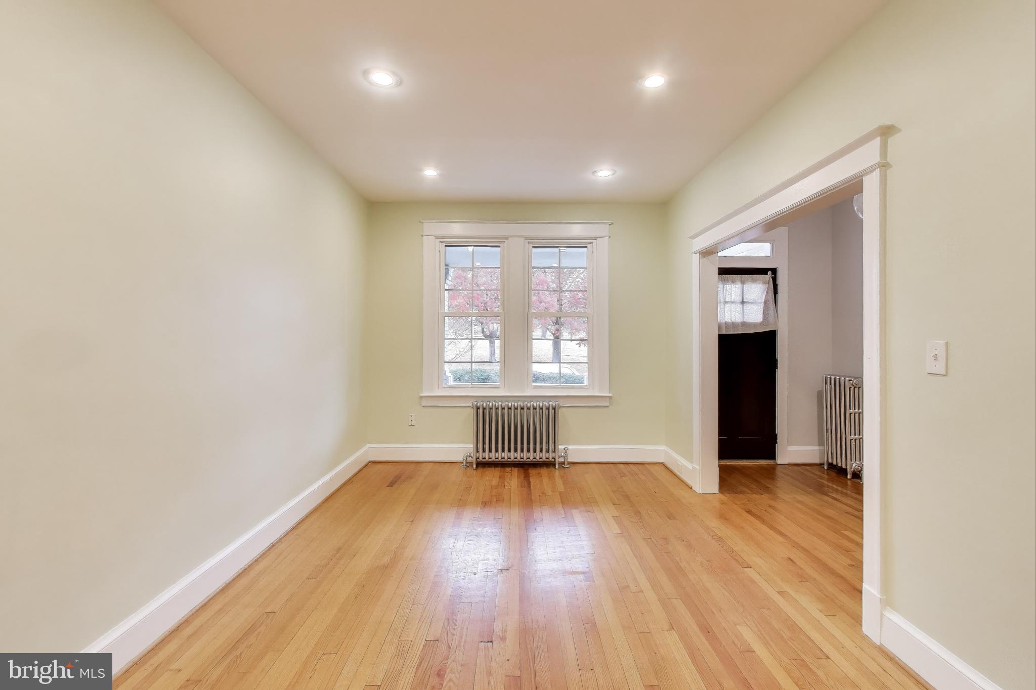 628 Madison Street Northwest Washington, DC 20011 - Photo 22 of 47 wooden floor in an empty room with a window