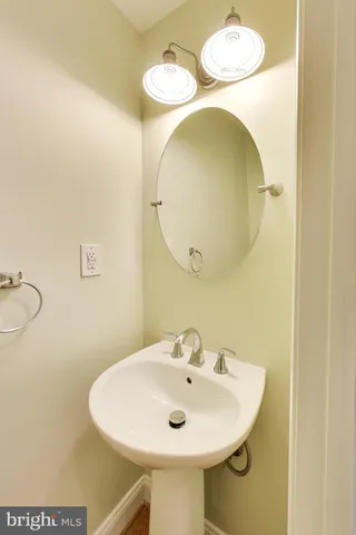 a view of an empty room with window and entryway