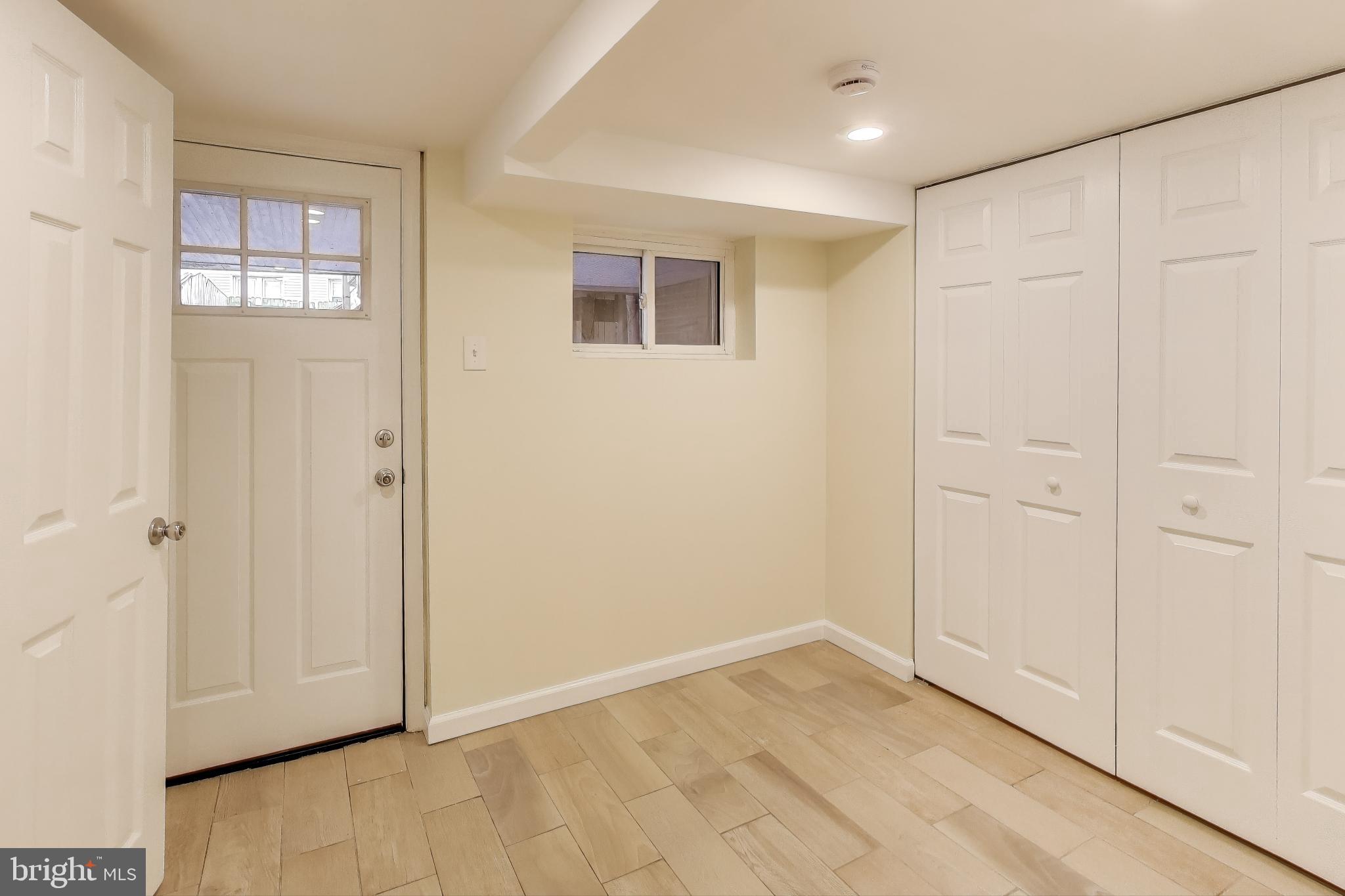 628 Madison Street Northwest Washington, DC 20011 - Photo 32 of 47 a view of an empty room with window and entryway