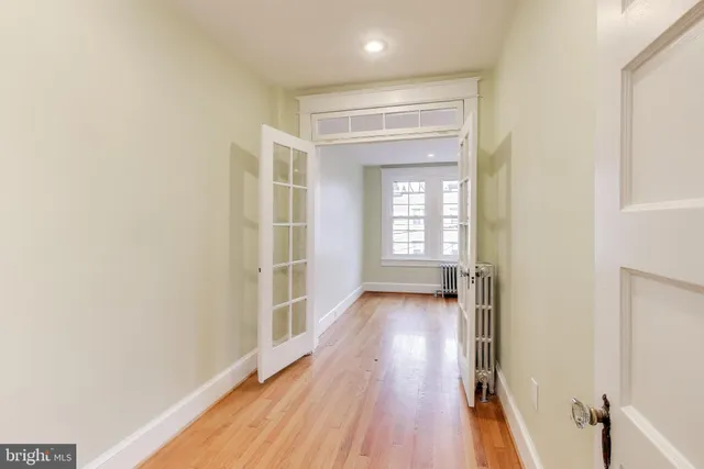 a bathroom with a bathtub a sink a toilet and a mirror