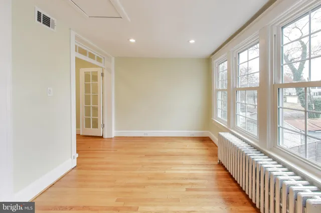 a open kitchen with kitchen island a sink stove and wooden floor