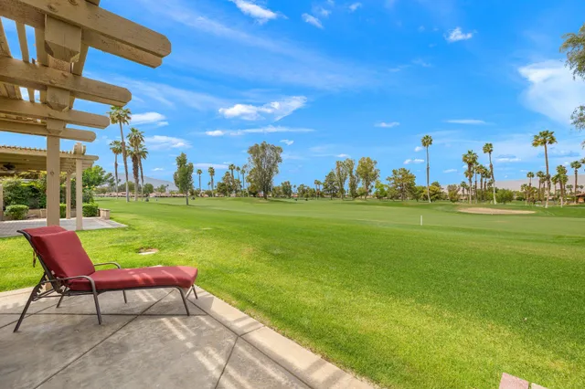 a backyard of a house with outdoor seating