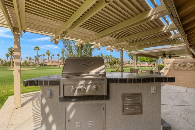 a view of a chairs and table in the patio