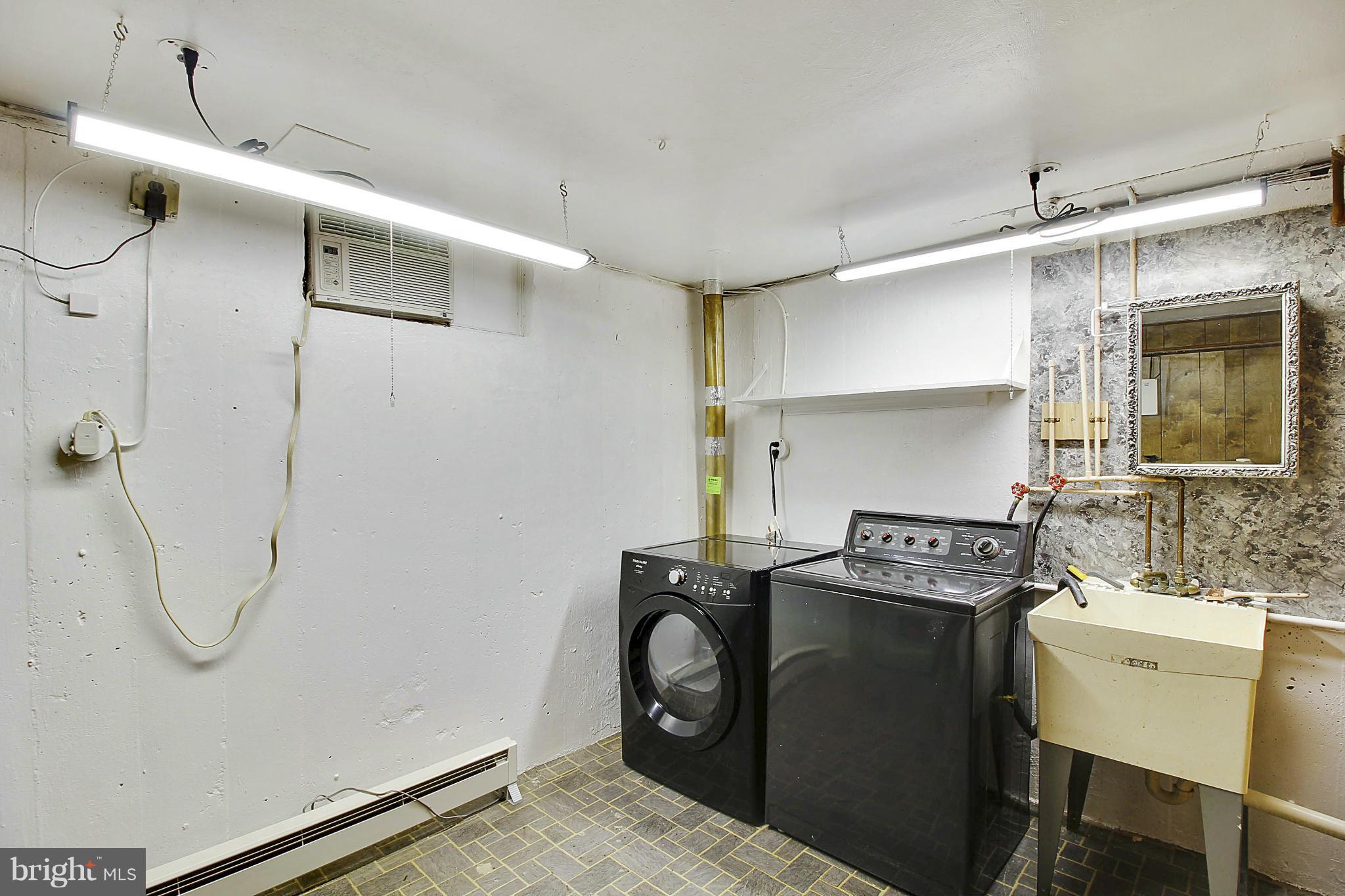 12128 Veirs Mill Road Silver Spring, MD 20906 - Photo 23 of 30 a utility room with dryer and washer
