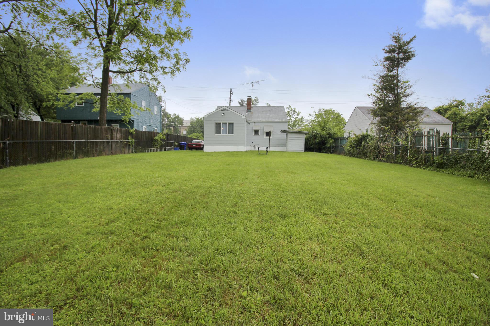 12128 Veirs Mill Road Silver Spring, MD 20906 - Photo 26 of 30 a house with a yard