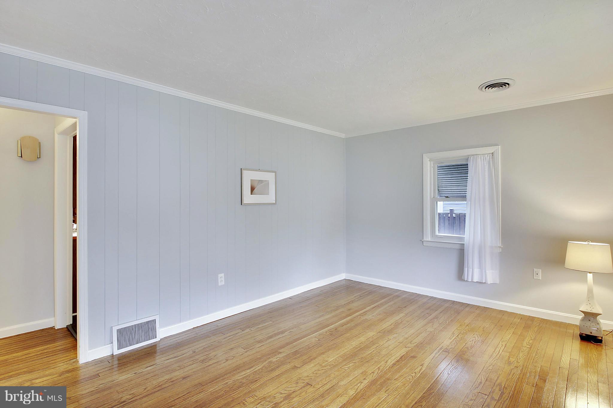 12128 Veirs Mill Road Silver Spring, MD 20906 - Photo 7 of 30 a view of a livingroom with wooden floor