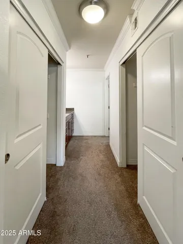 a view of a hallway with closet