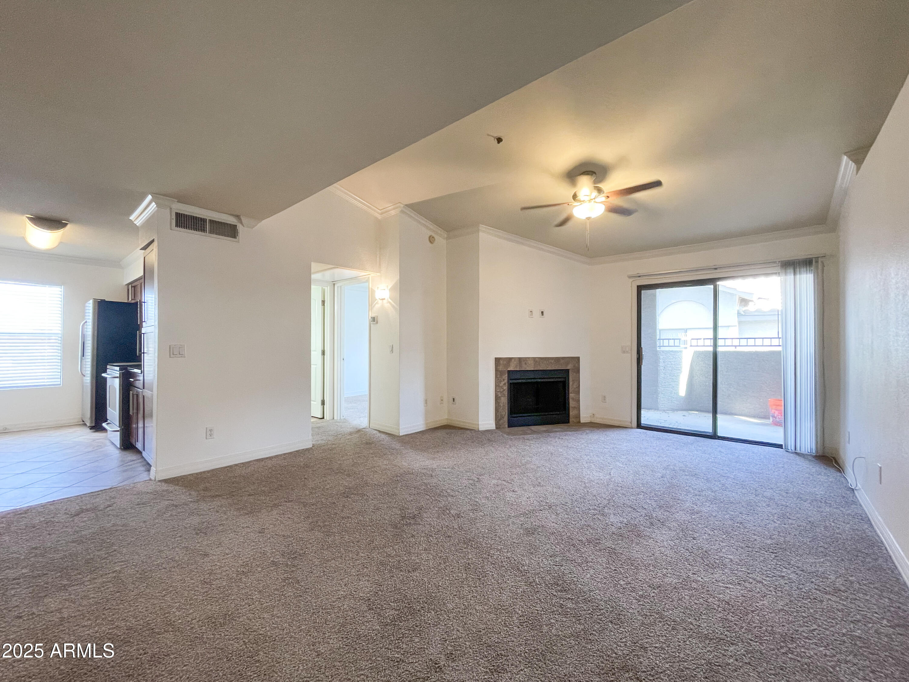 2025 East Campbell Avenue, Unit 312 Phoenix, AZ 85016 - Photo 14 of 16 a view of an empty room with a fireplace