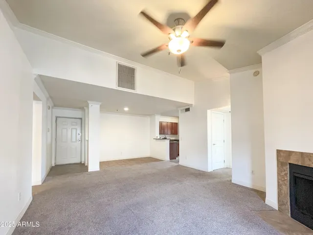 a view of a livingroom with a chandelier fan