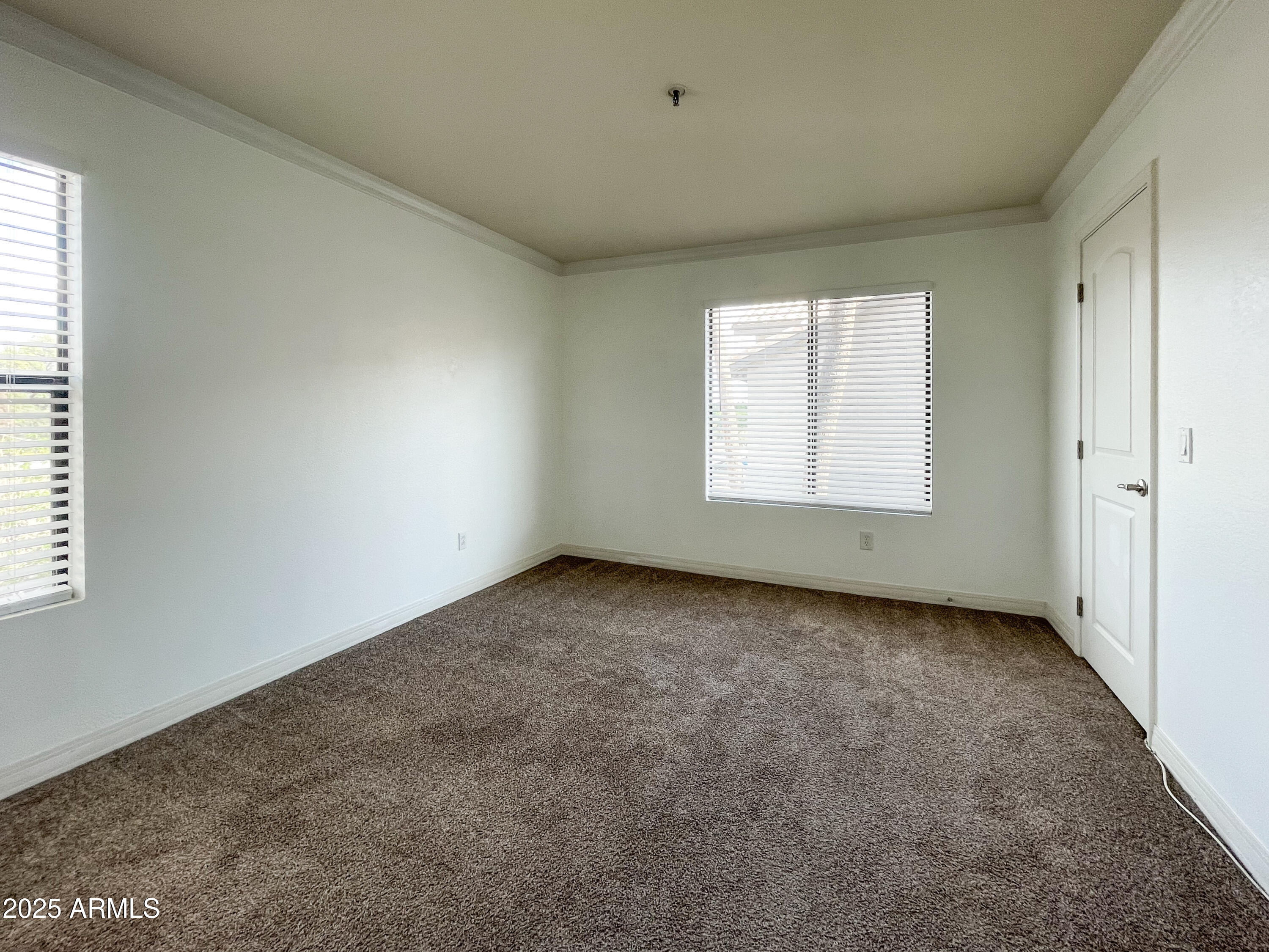 2025 East Campbell Avenue, Unit 312 Phoenix, AZ 85016 - Photo 7 of 16 an empty room with a window