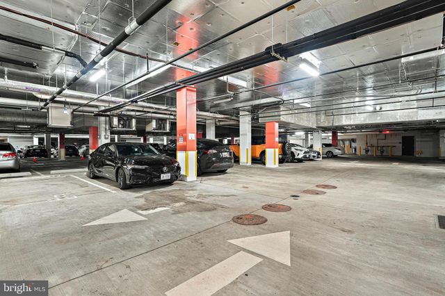 a view of parking garage with cars