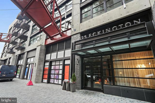 a view of a building with car parked