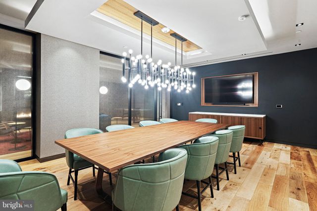 a view of a patio with a table and chairs