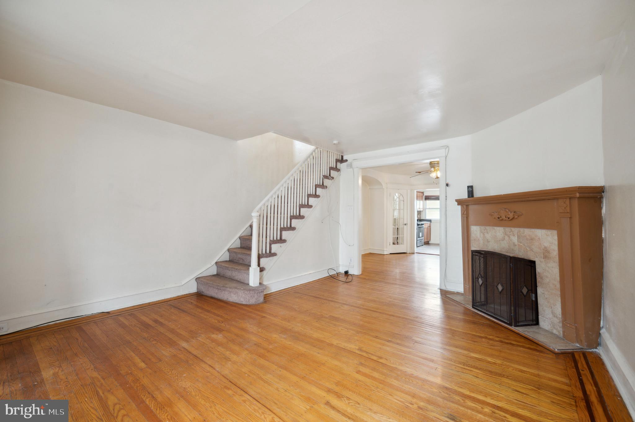 275 Copley Road Upper Darby, PA 19082 - Photo 3 of 24 Living Room w/Hardwood Floors & Fireplace