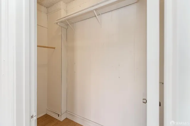 a kitchen with cabinets stainless steel appliances and a counter space