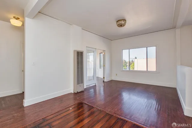 a spacious bathroom with a bathtub sink mirror and toilet