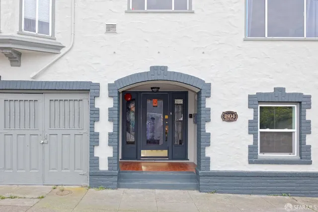 a front view of a house with a glass door