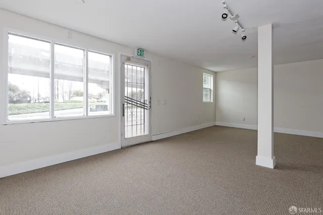 a view of an empty room with a window