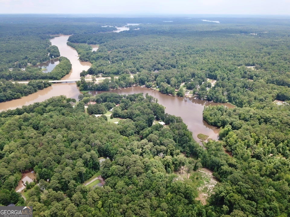 Lot 184 Southern Shores Road Jackson, GA 30233 - Photo 5 of 16 an aerial view of a house with a yard and lake view