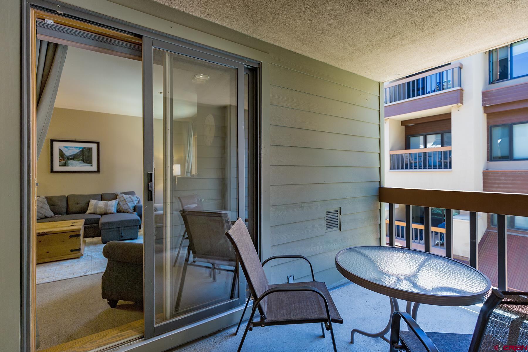 71 Needles Way, Unit 443 Durango, CO 81301 - Photo 13 of 26 a living room with furniture and a window