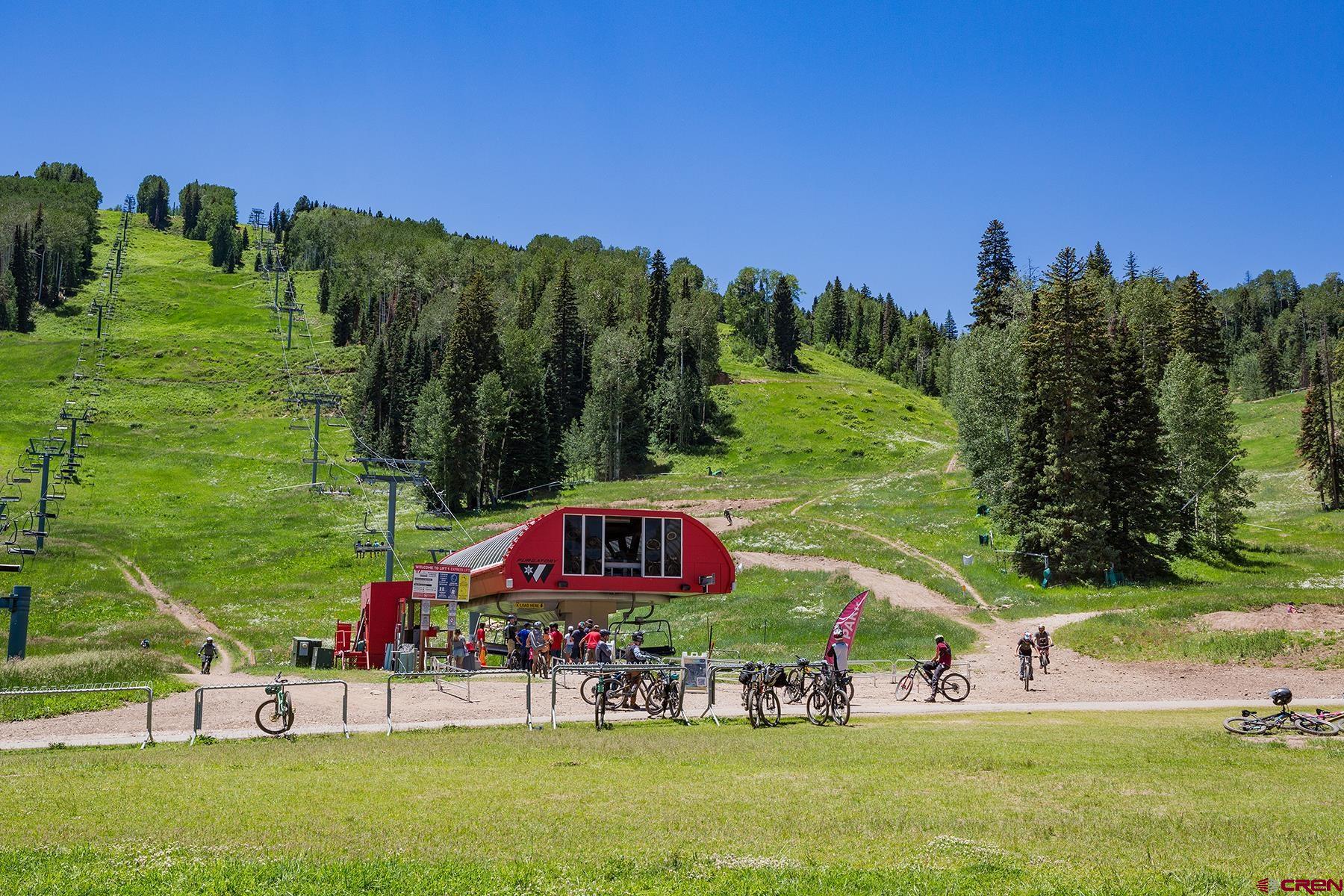 71 Needles Way, Unit 443 Durango, CO 81301 - Photo 17 of 26 a view of a two chairs in a yard