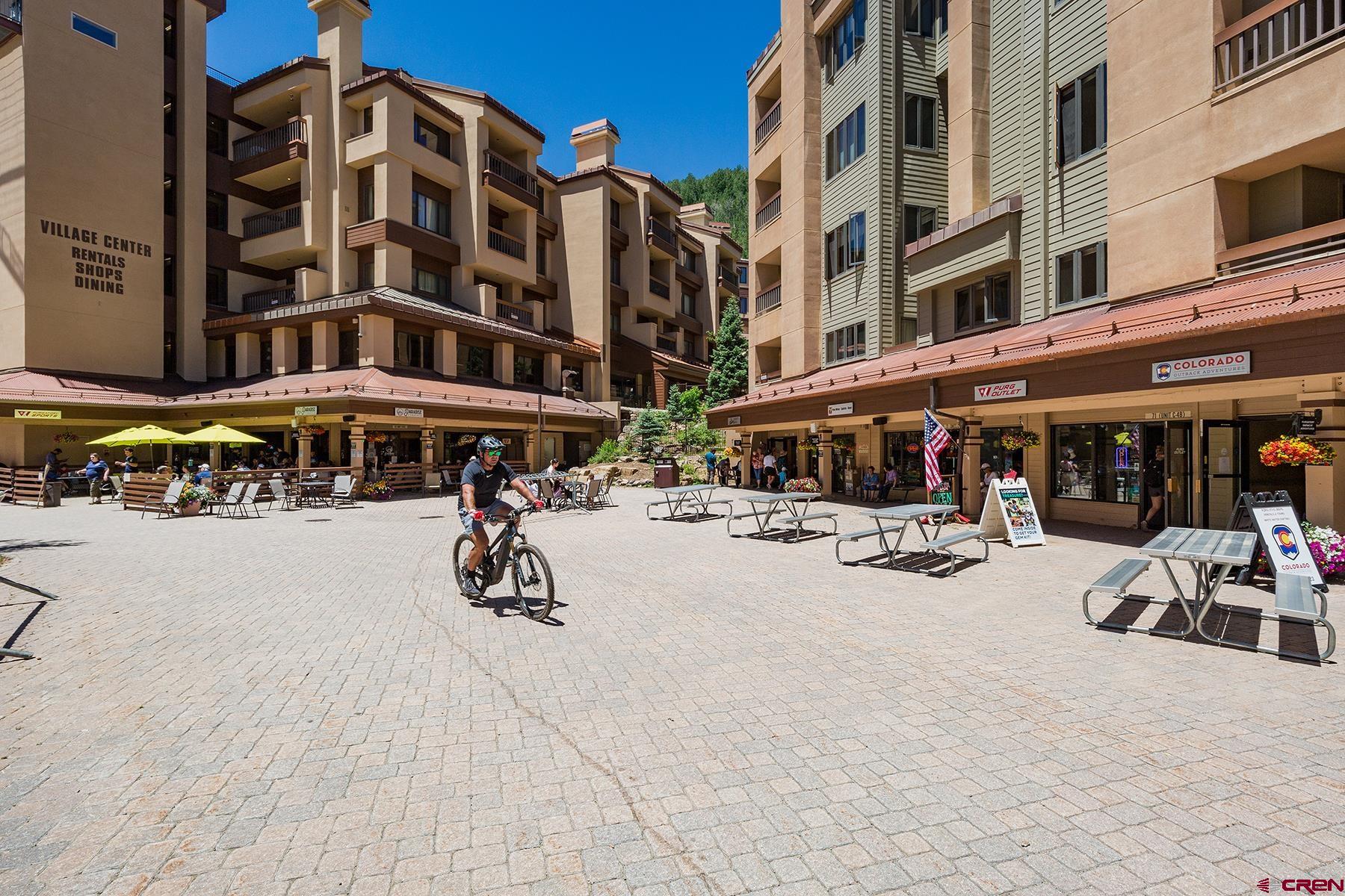 71 Needles Way, Unit 443 Durango, CO 81301 - Photo 23 of 26 a street view with tall buildings and a street