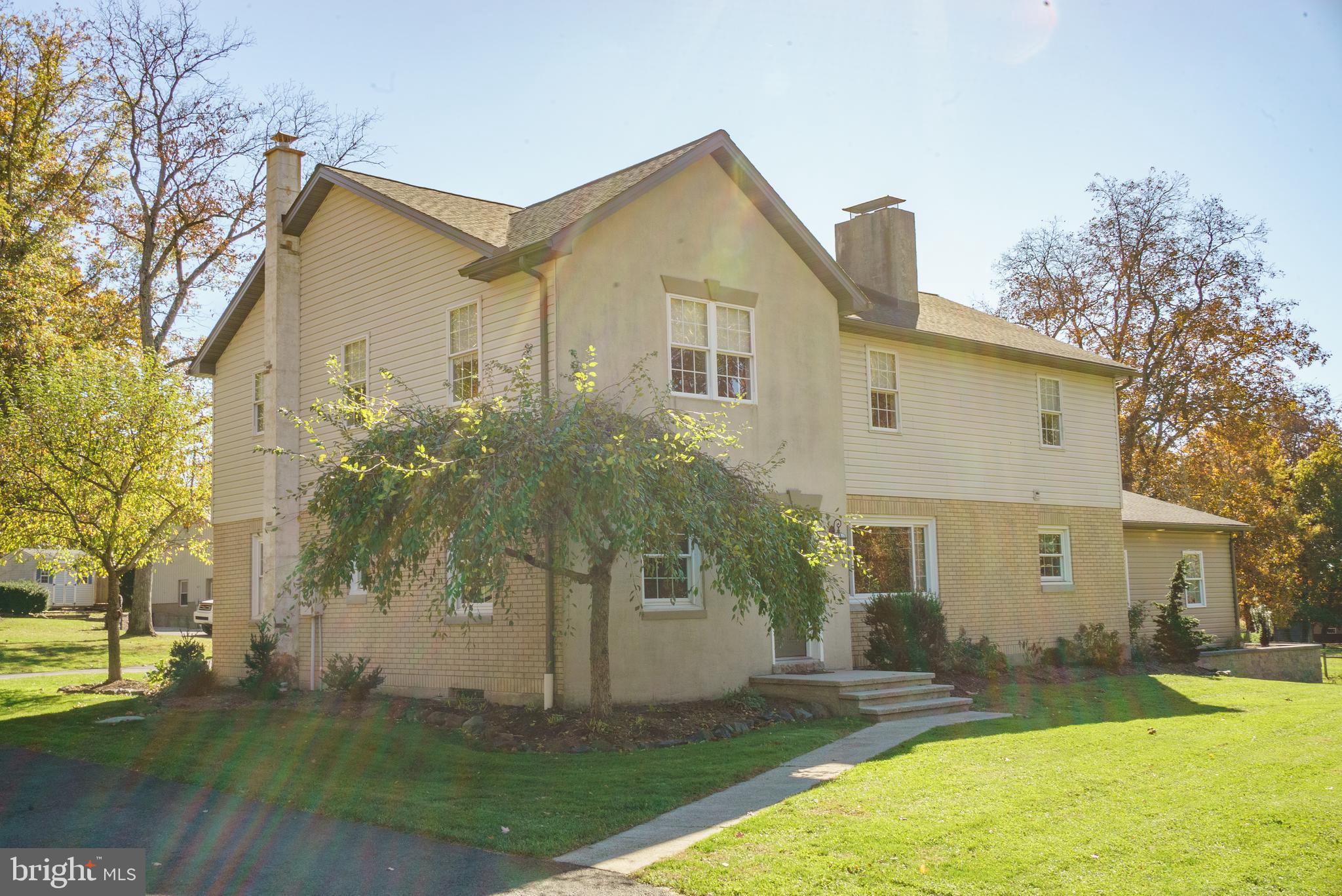 1682 Reading Road Mohnton, PA 19540 - Photo 21 of 73 a front view of a house with a yard and trees