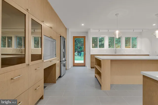 a kitchen with stainless steel appliances granite countertop a stove and a sink