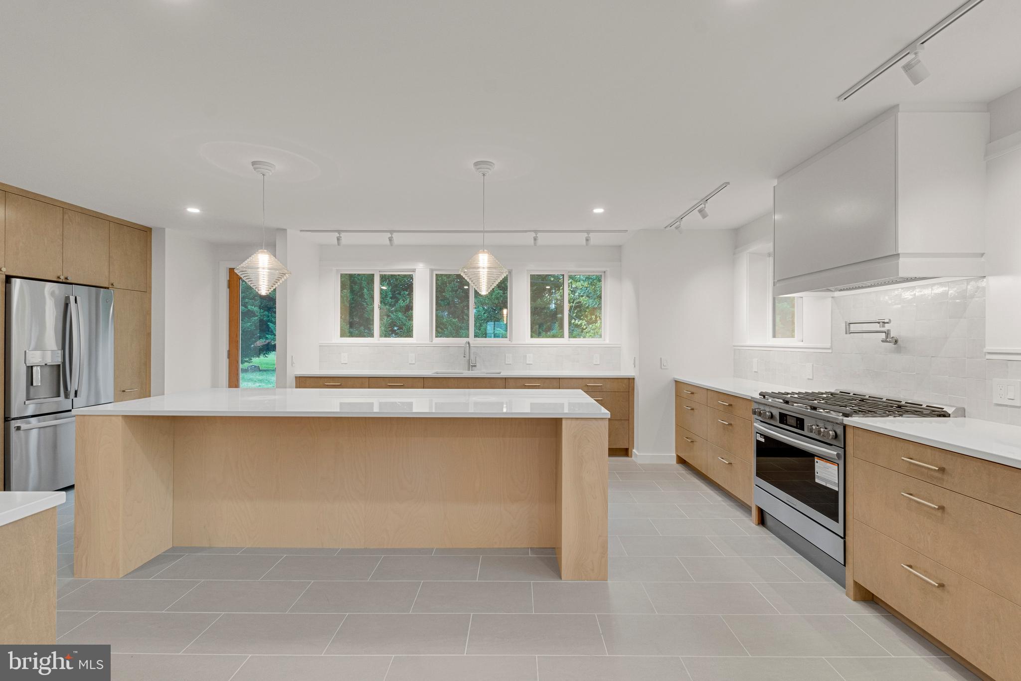 2706 Bartol Avenue Baltimore, MD 21209 - Photo 14 of 62 a kitchen with stainless steel appliances granite countertop a stove and a sink