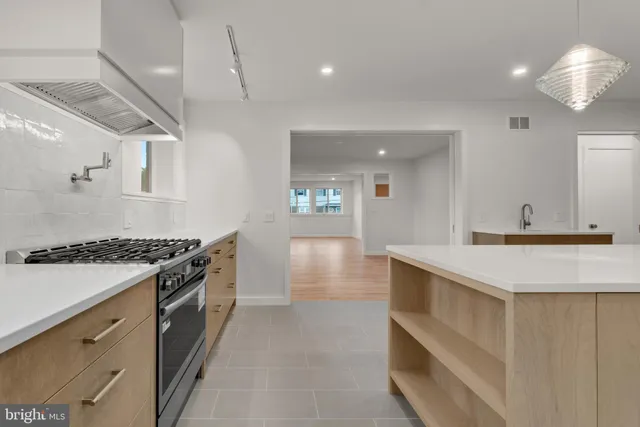 a kitchen with a refrigerator and cabinets