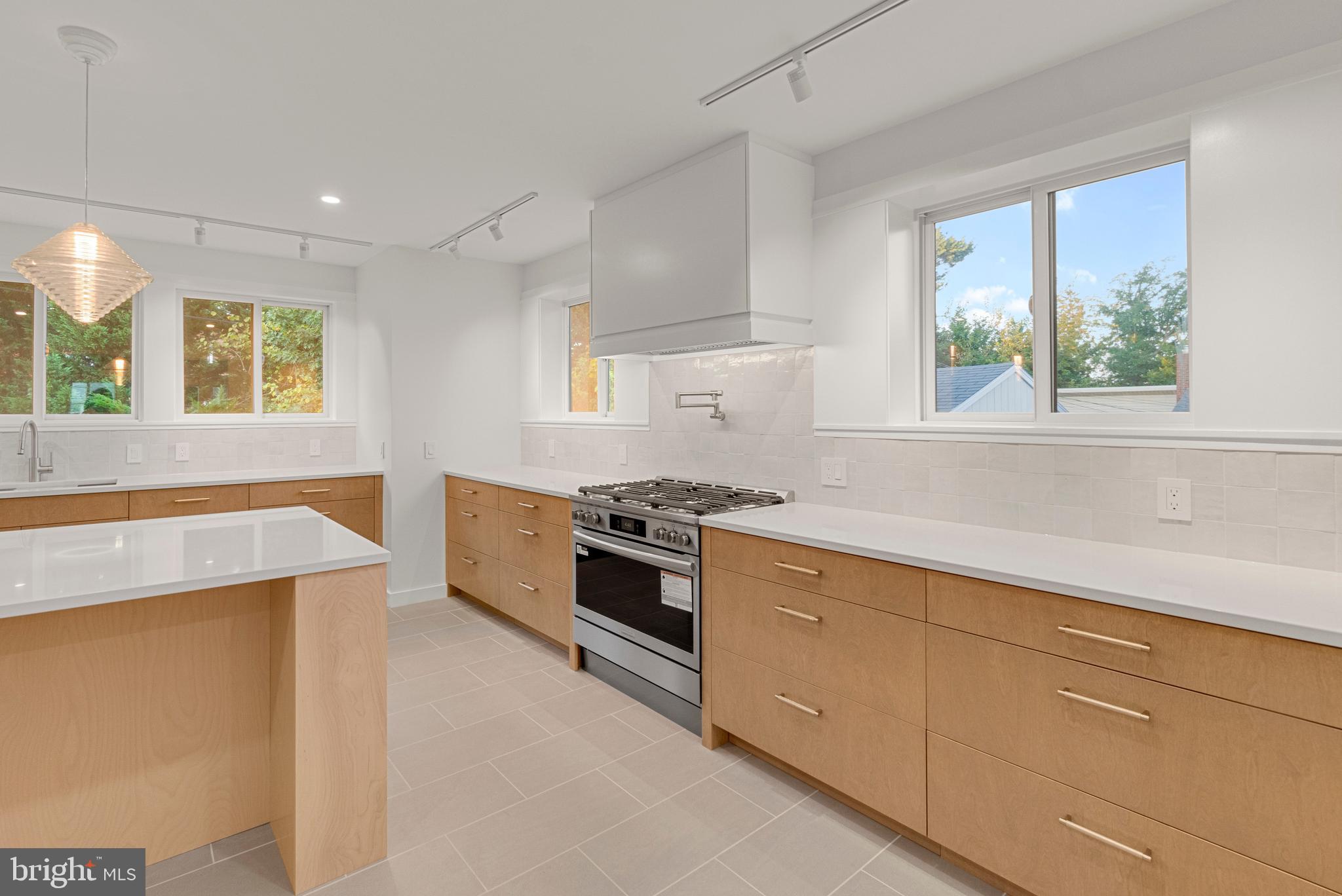 2706 Bartol Avenue Baltimore, MD 21209 - Photo 24 of 62 a kitchen with a stove a sink and a window
