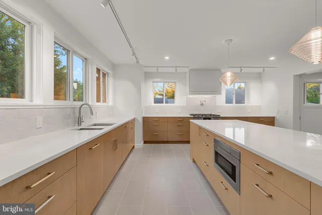 a view of room with window and wooden floor