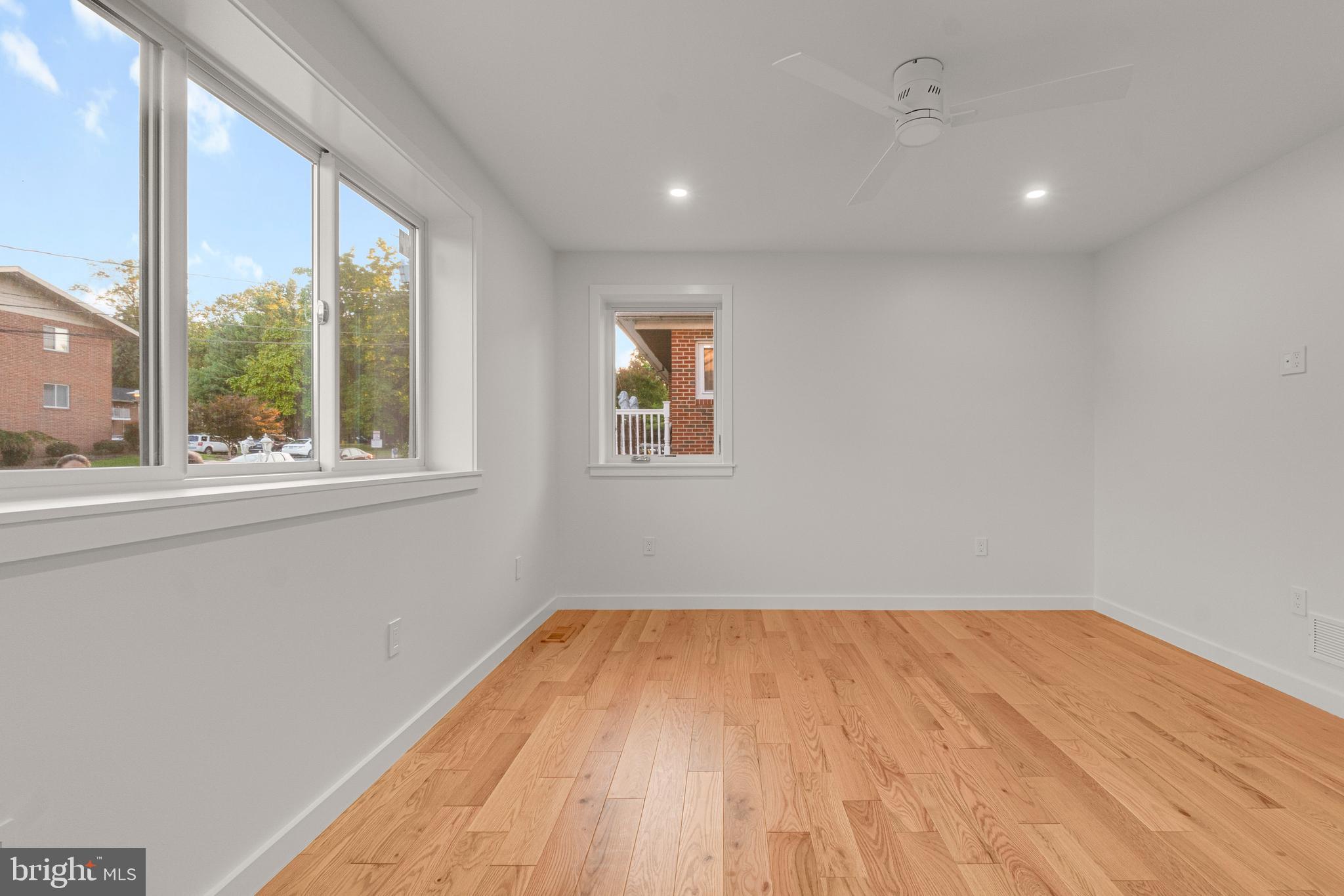 2706 Bartol Avenue Baltimore, MD 21209 - Photo 31 of 62 a view of empty room with wooden floor and fan