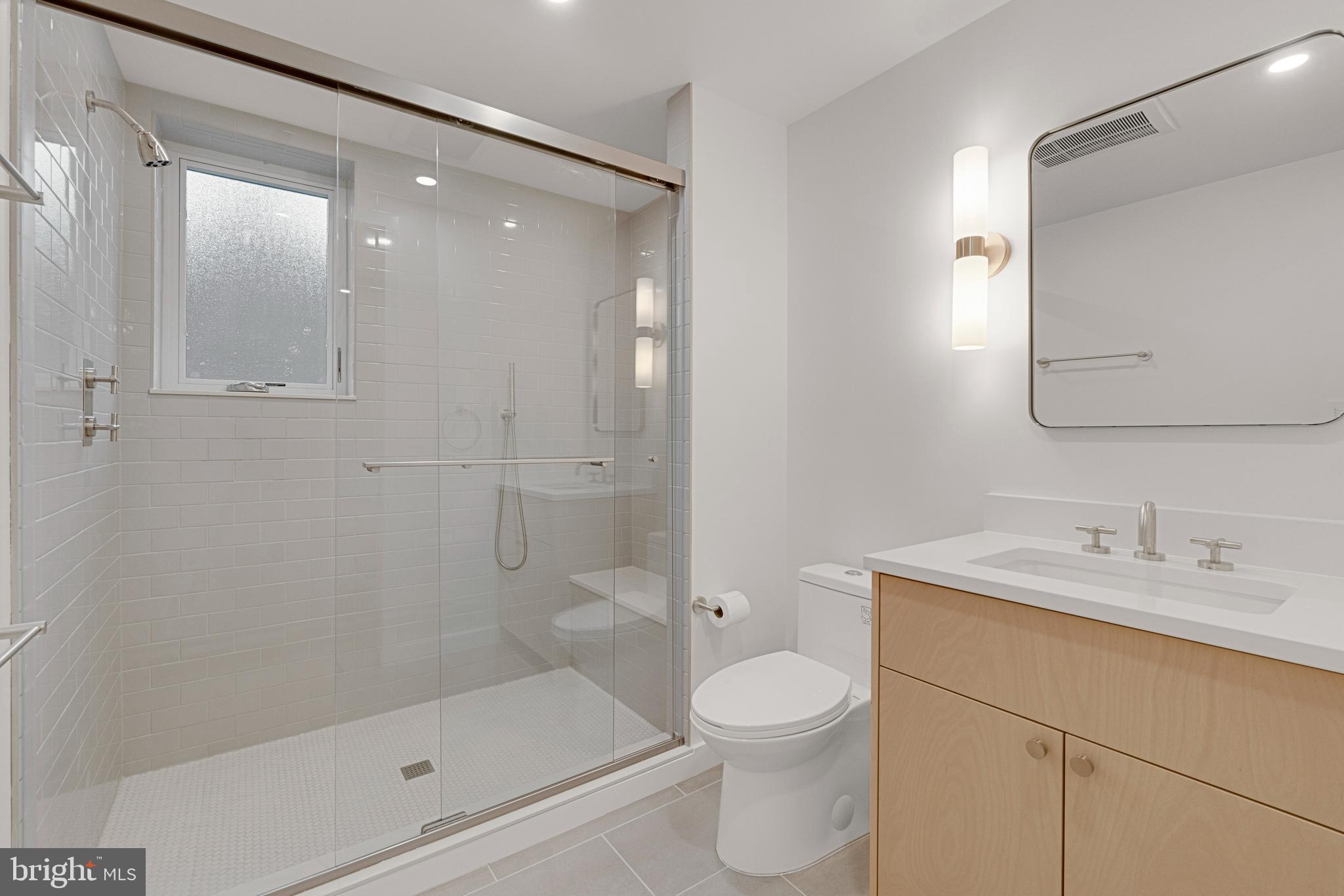 2706 Bartol Avenue Baltimore, MD 21209 - Photo 34 of 62 a bathroom with a sink a toilet and shower