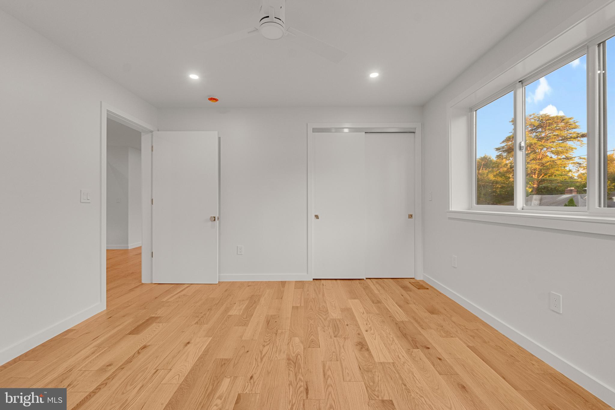 2706 Bartol Avenue Baltimore, MD 21209 - Photo 35 of 62 a view of room with window and wooden floor