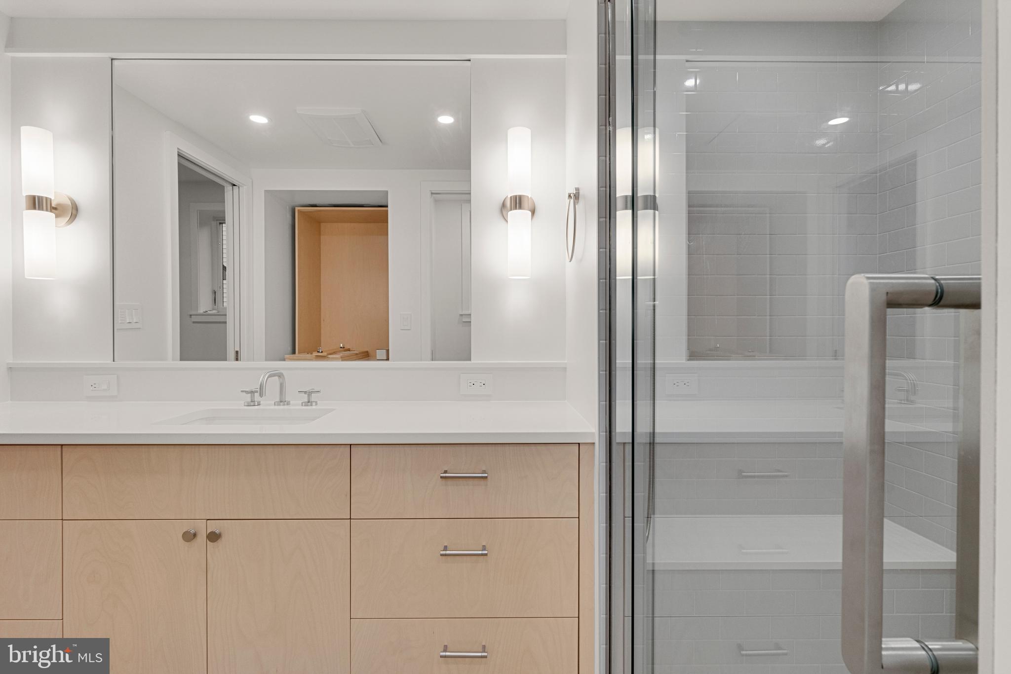 2706 Bartol Avenue Baltimore, MD 21209 - Photo 39 of 62 a bathroom with a sink and a mirror