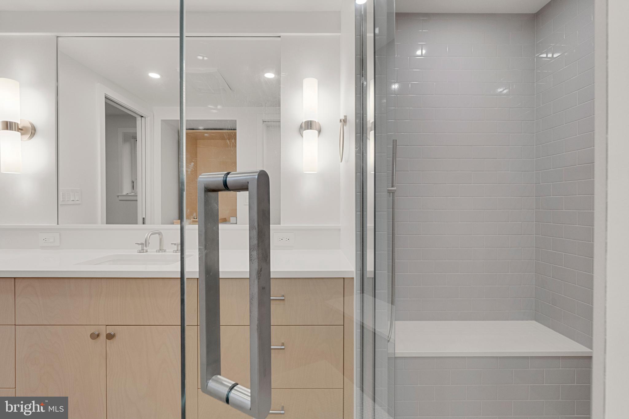 2706 Bartol Avenue Baltimore, MD 21209 - Photo 40 of 62 a bathroom with a shower and a mirror