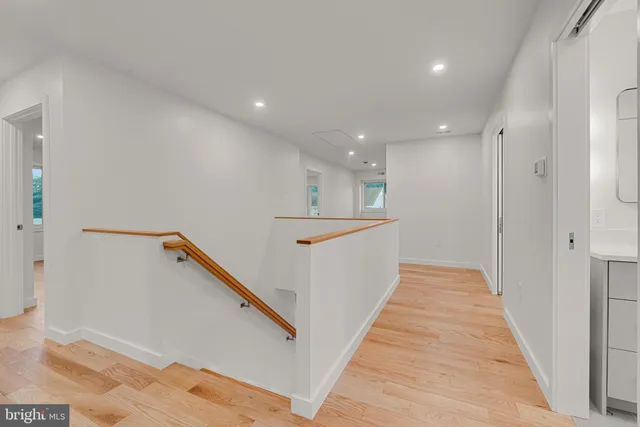 a view of an empty room with windows