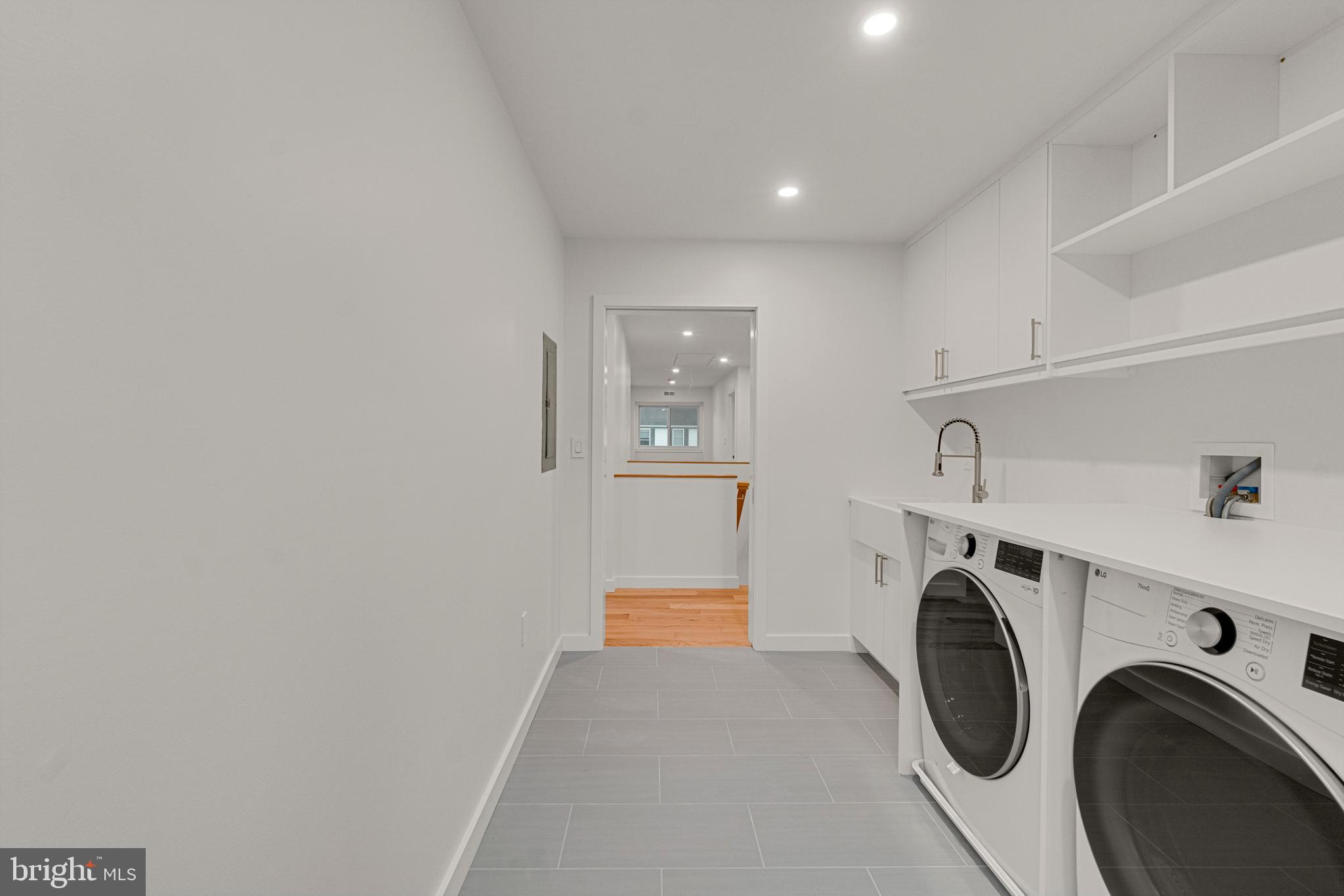 2706 Bartol Avenue Baltimore, MD 21209 - Photo 45 of 62 a view of hallway with washer and dryer