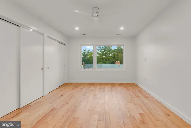 a view of a pathway with a wooden door